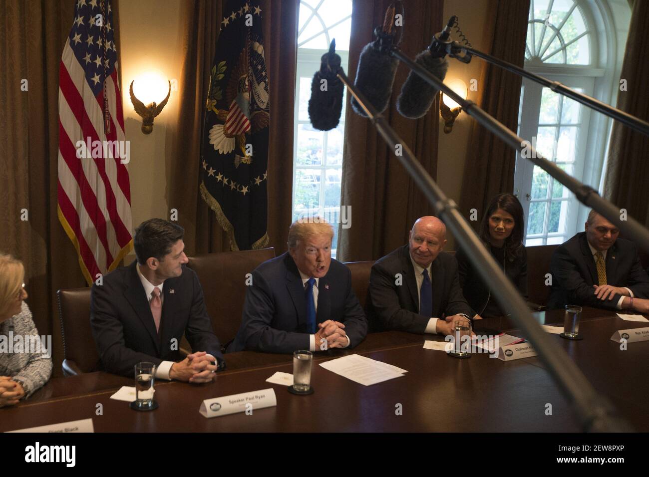 President of the United States Donald J Trump, flaked by Speaker of the