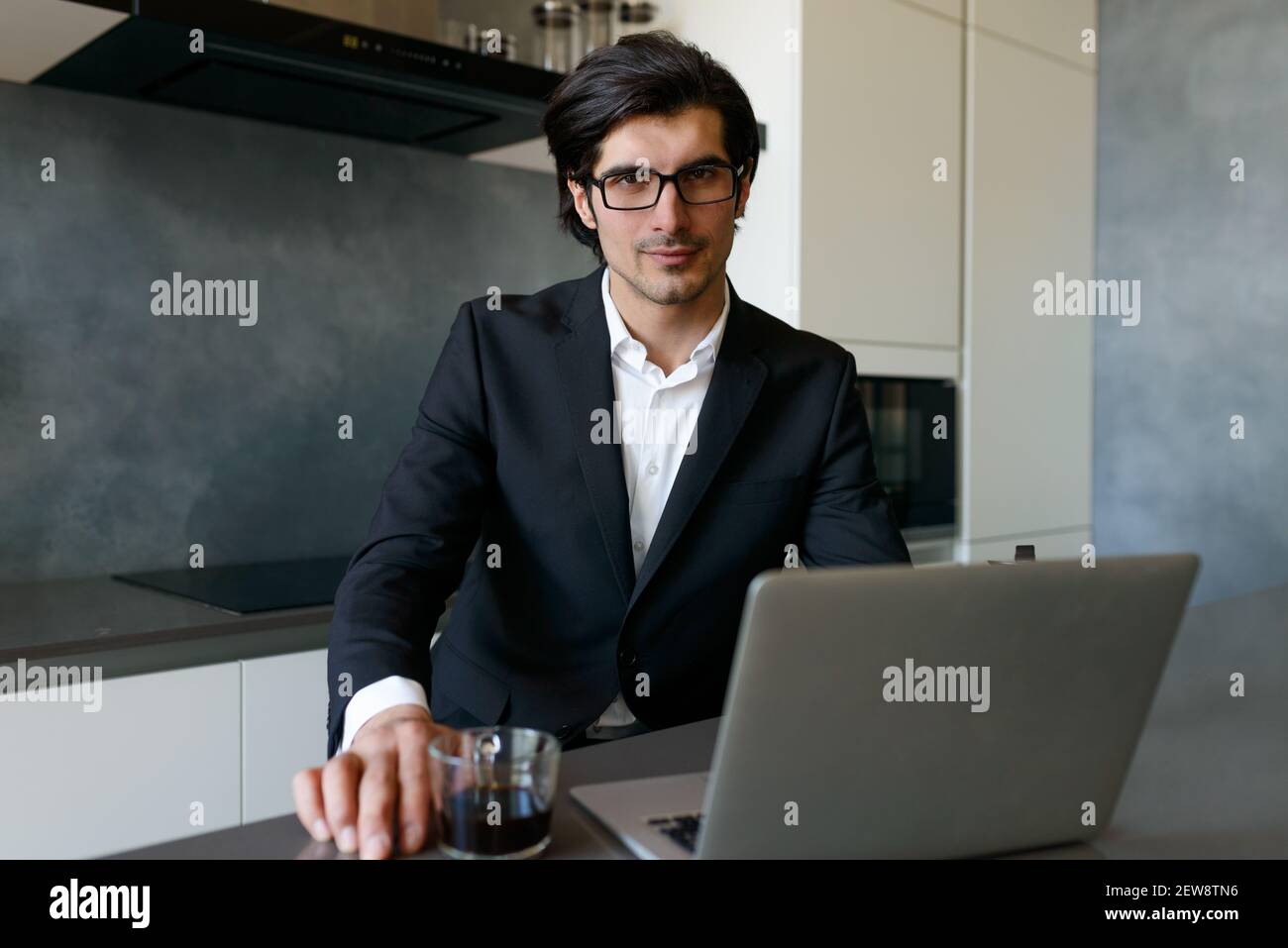 Man teleworker works at home with a laptop Stock Photo
