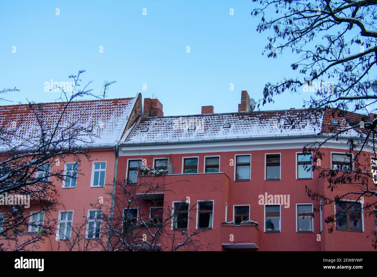 Snowy apartment rooftops and tree landscape Schoneberg Berlin Germany ...