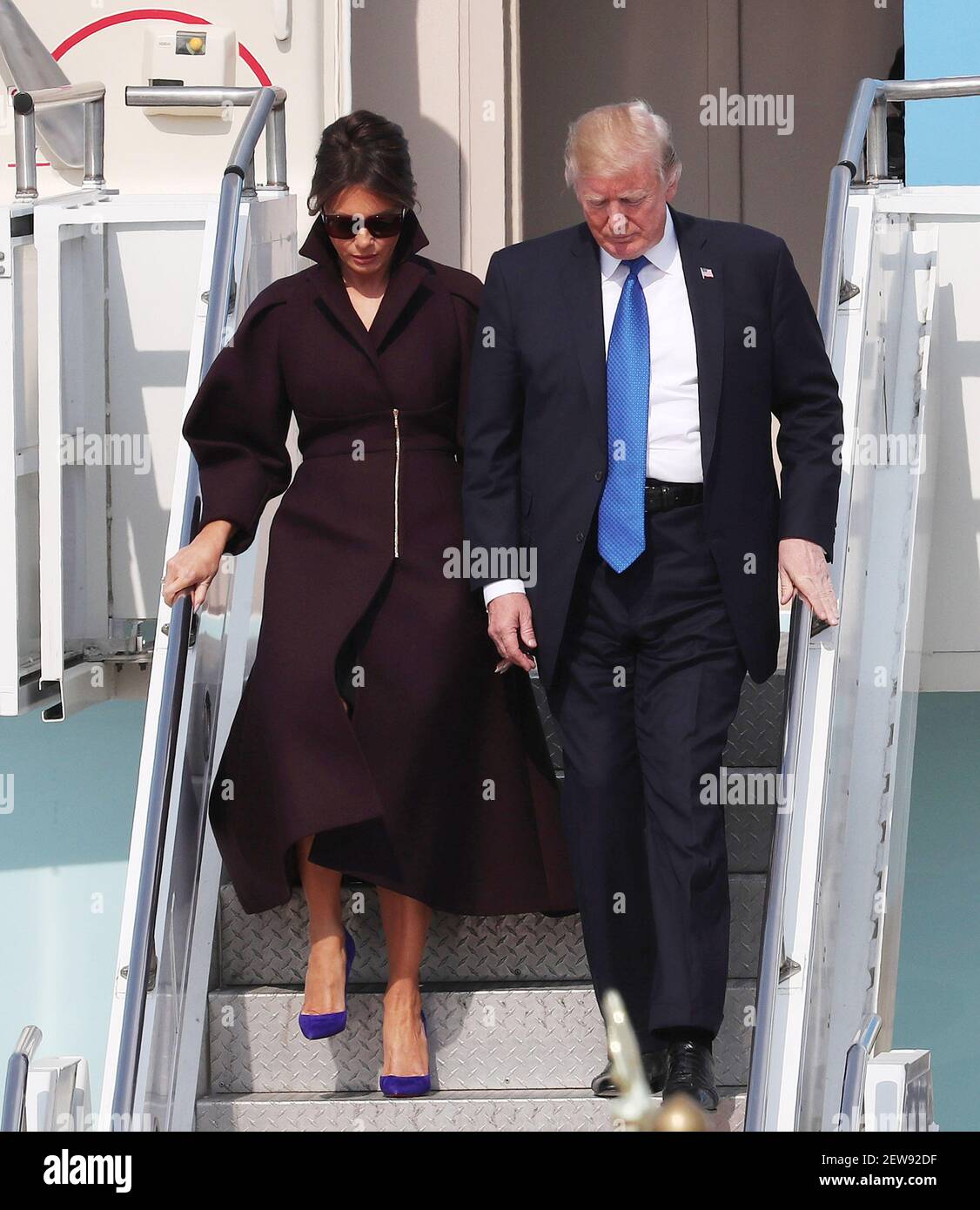 7 November 2017 - Osan, South Korea : U.S. President Donald Trump, (right),  and first lady Melania Trump, wave on their arrival at the U.S. Osan  Military Air Base in Osan, South