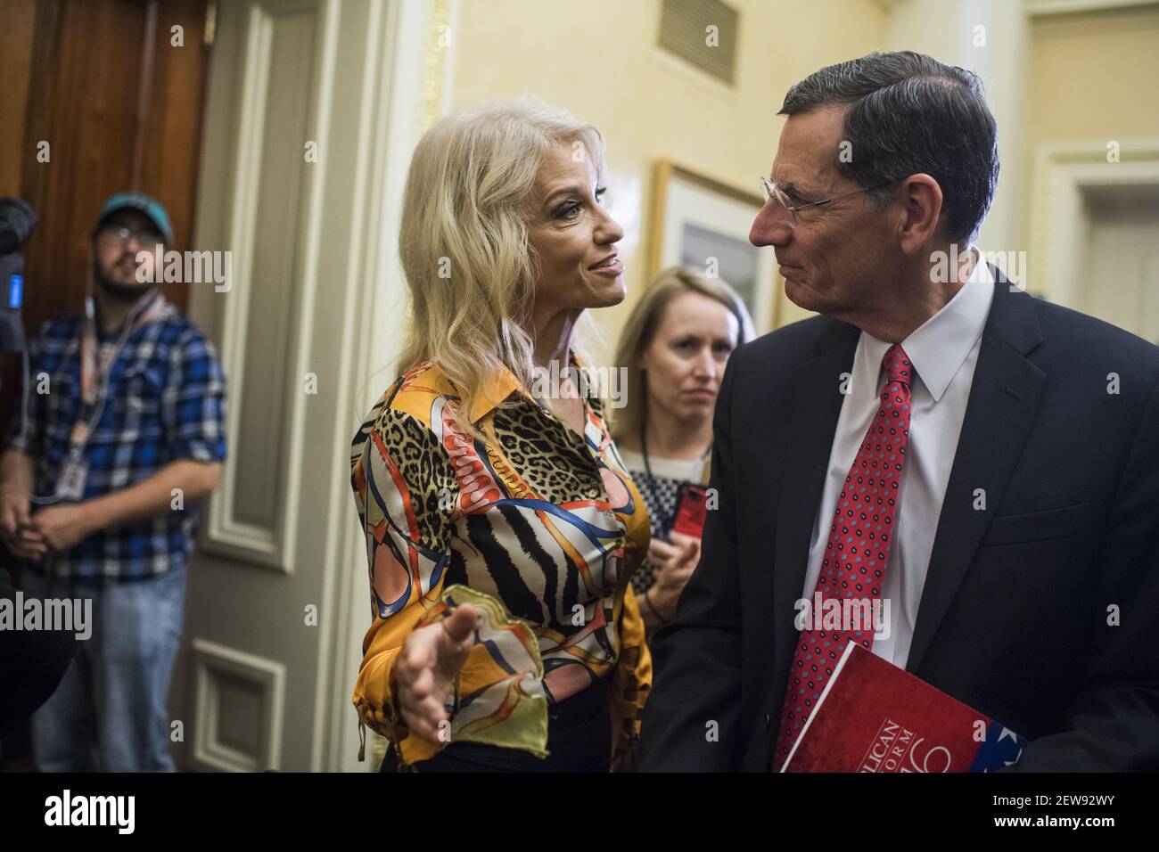 UNITED STATES - NOVEMBER 07: Sen. John Barrasso, R-Wyo., and White House counselor Kellyanne Conway, are seen after a news conference in the Capitol where GOP senators said families and small businesses would benefit from tax reform on November 7, 2017. (Photo By Tom Williams/CQ Roll Call) Stock Photo