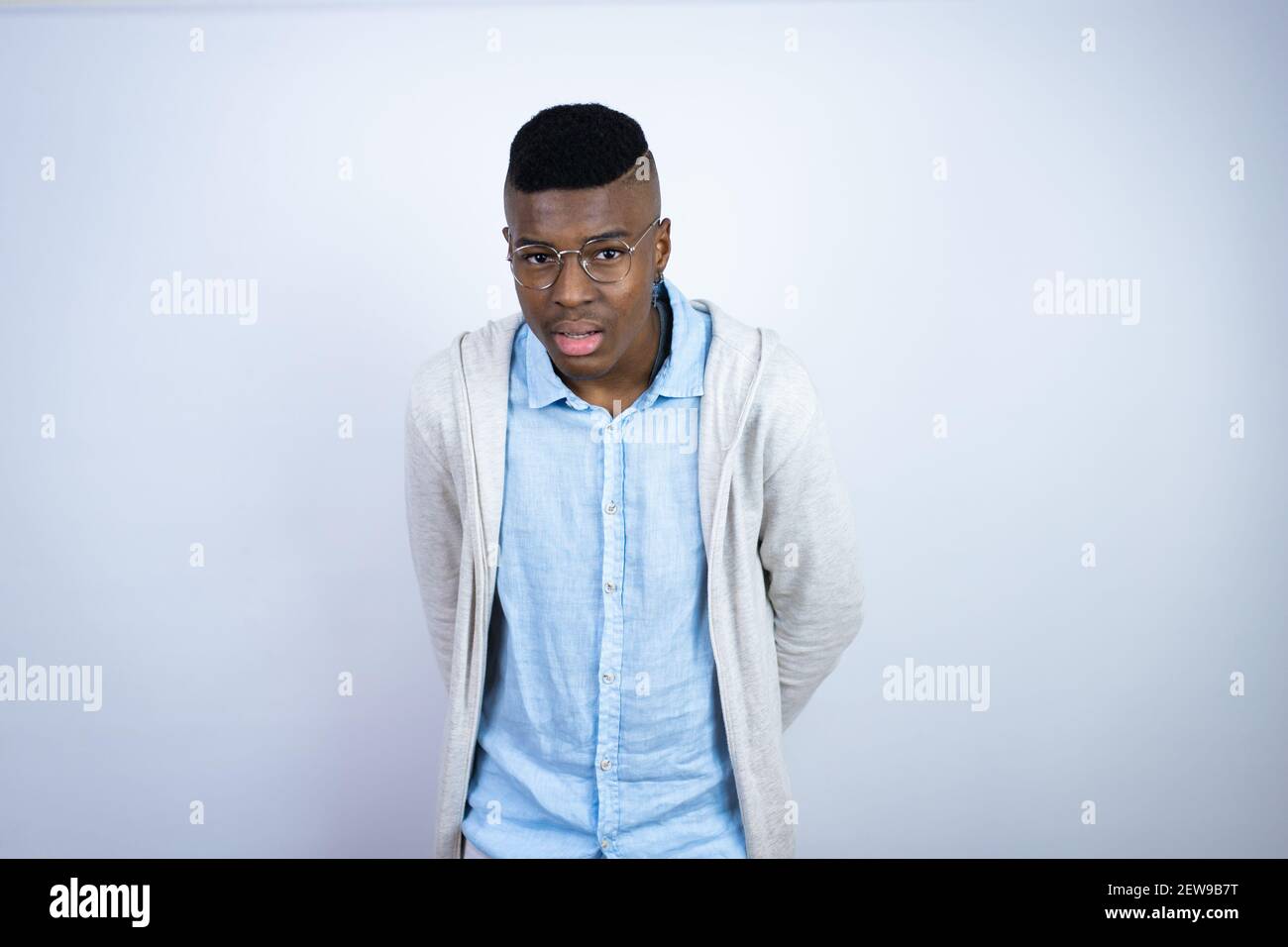 Young handsome african american man wearing casual clothes afraid and shocked with surprise and amazed expression, fear and excited face. Stock Photo
