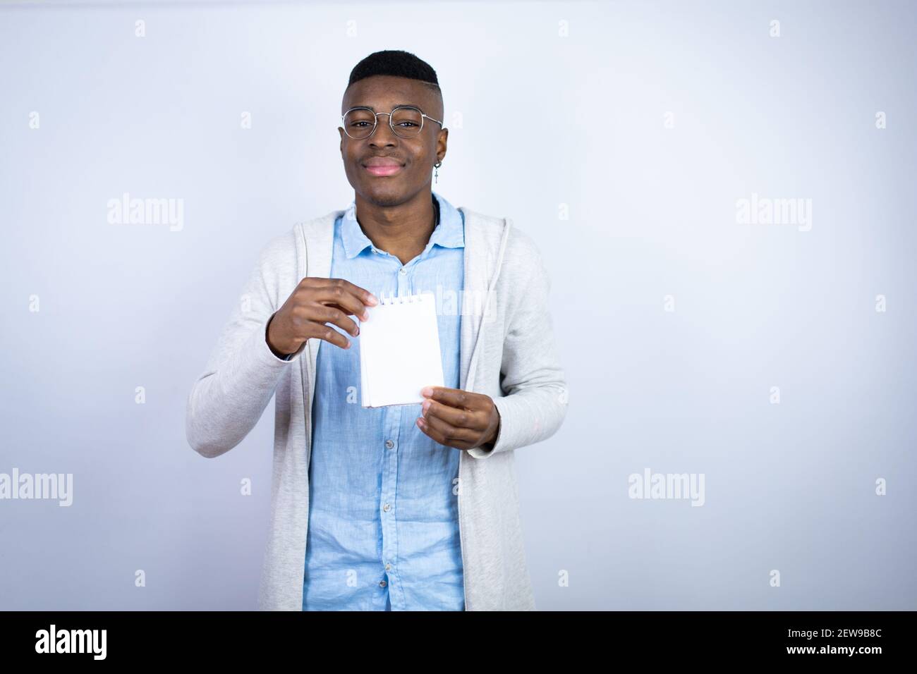 Young handsome african american man wearing casual clothes smiling and ...