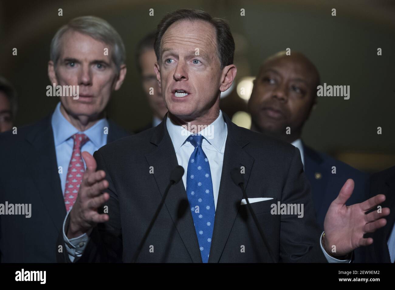 UNITED STATES - NOVEMBER 14: Sen. Pat Toomey, R-Pa., speaks with the media after the Republican Senate Policy luncheon in the Capitol on November 14, 2017. Also appearing are, from left, Sens. Rob Portman, R-Ohio, John Thune, R-S.D., and Tim Scott, R-S.C. (Photo By Tom Williams/CQ Roll Call) Stock Photo
