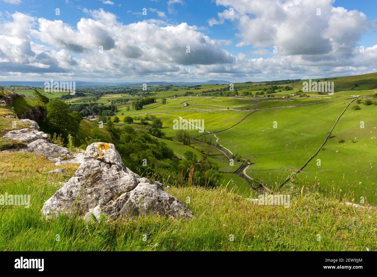 Stunning View over Malham from Malham Cove in Summer overlooking ancient green fields and field borders, Yorkshire Dales Stock Photo