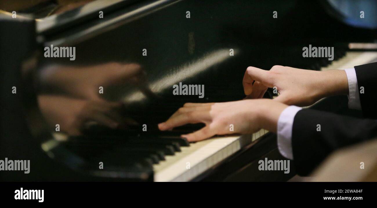 Daniel Colaner, 12, plays Chopin fantasie impromptu opus 66 on the piano at Saint Sebastian Catholic Church in Akron, Ohio, on Wednesday, November 15, 2017. (Photo by Mike Cardew/Akron Beacon Journal/TNS/Sipa USA) Stock Photo
