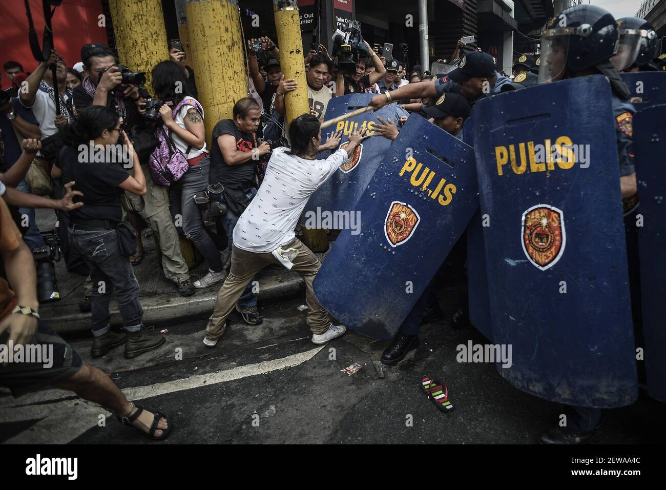Protesters scuffle with riot police during a demonstration against ...