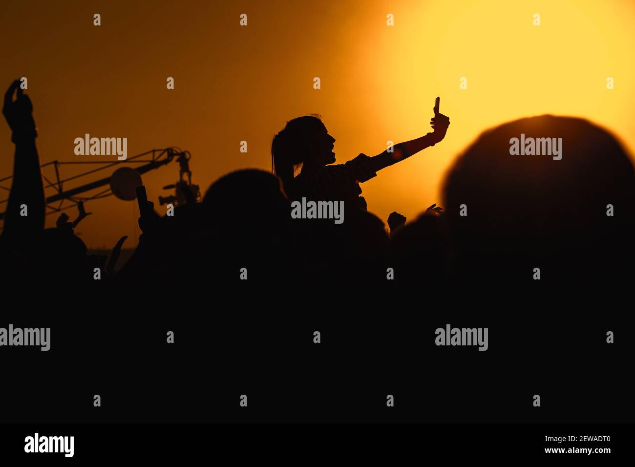 Girl silhouette on a big concert show Stock Photo