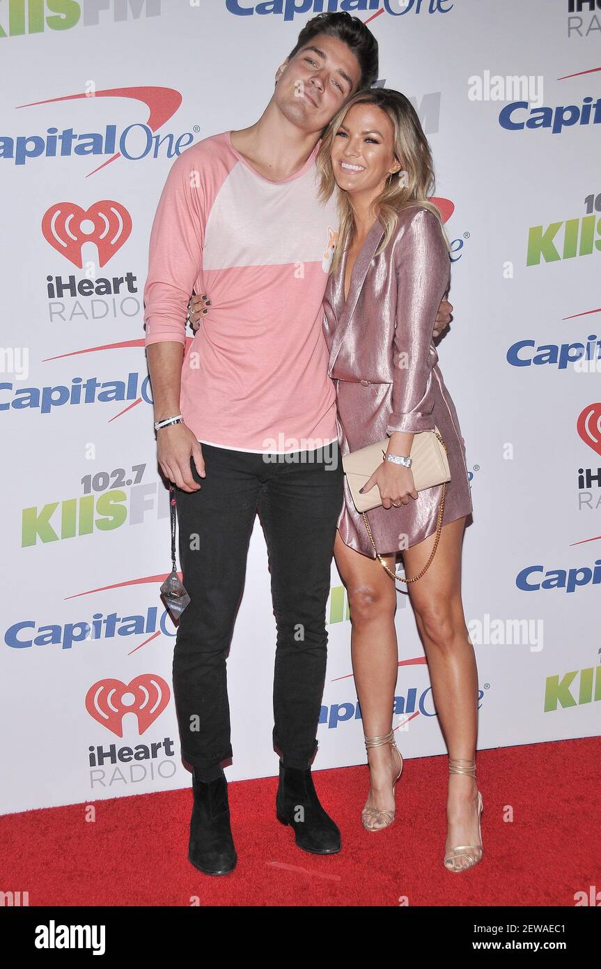 (L-R) Dean Unglert and Becca Tilley arrives at the KIISFM's iHeartRadio