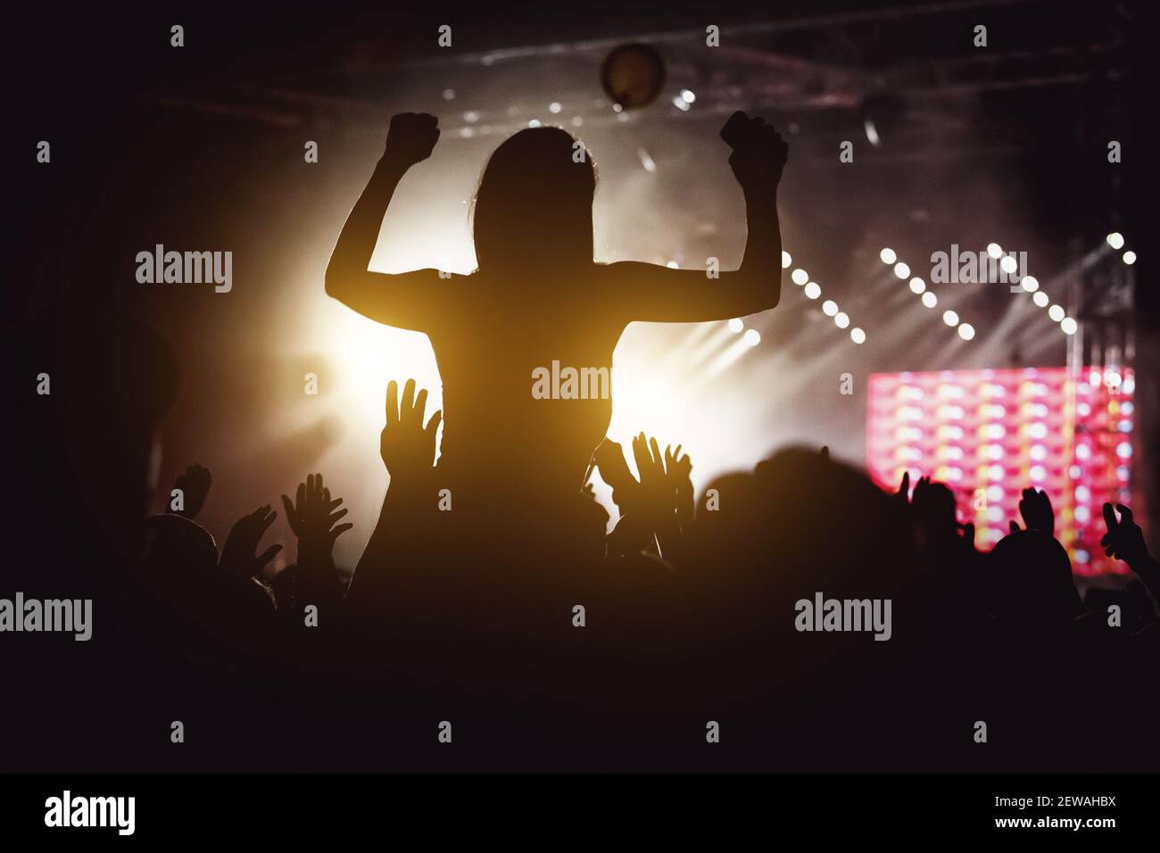 Girl silhouette on a big concert show Stock Photo