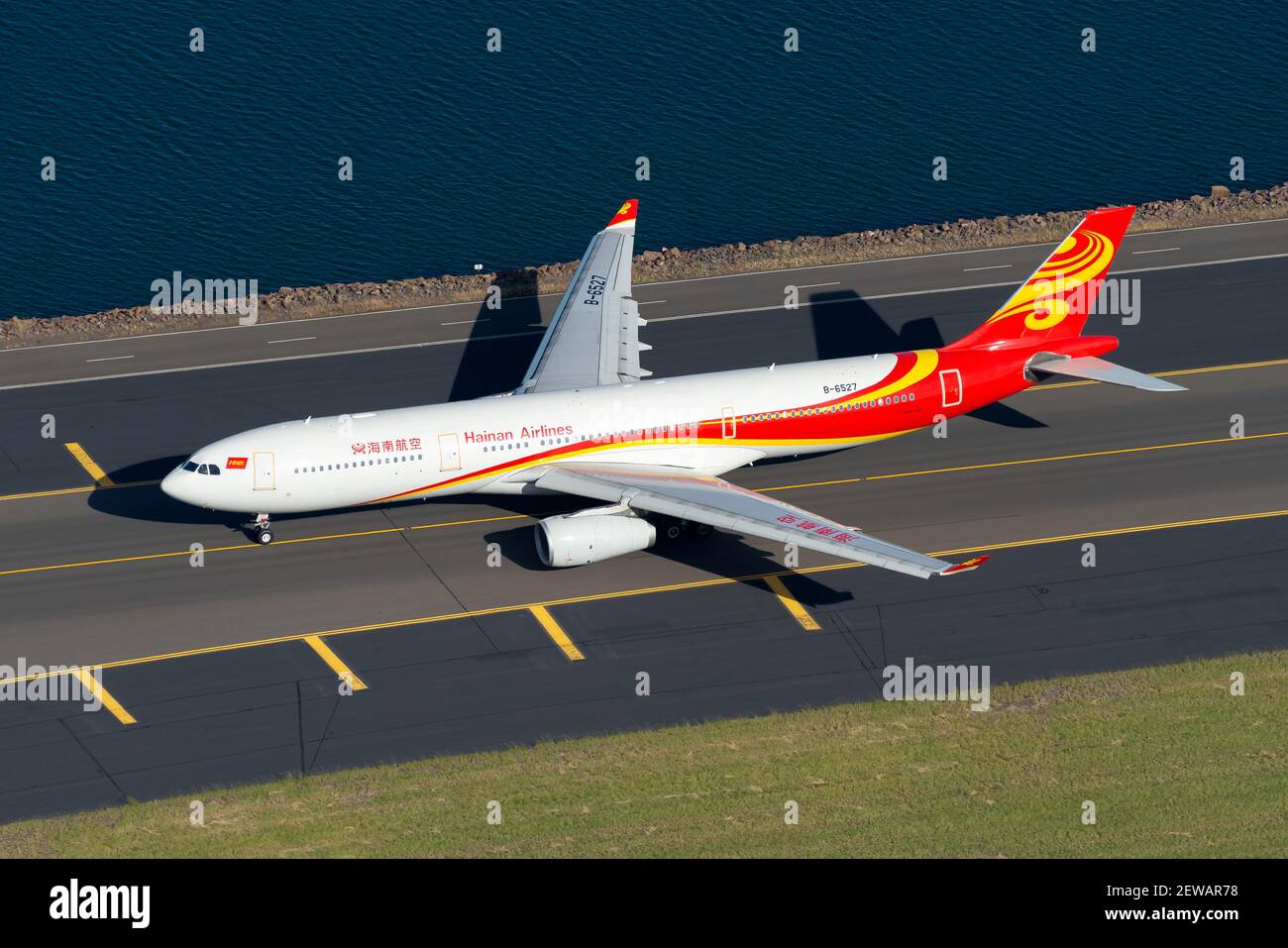 Hainan Airlines Airbus A330 aircraft seen from above at international airport. Aerial view of Airbus A330-300 airplane B-6527 of Hainan Airline. Stock Photo