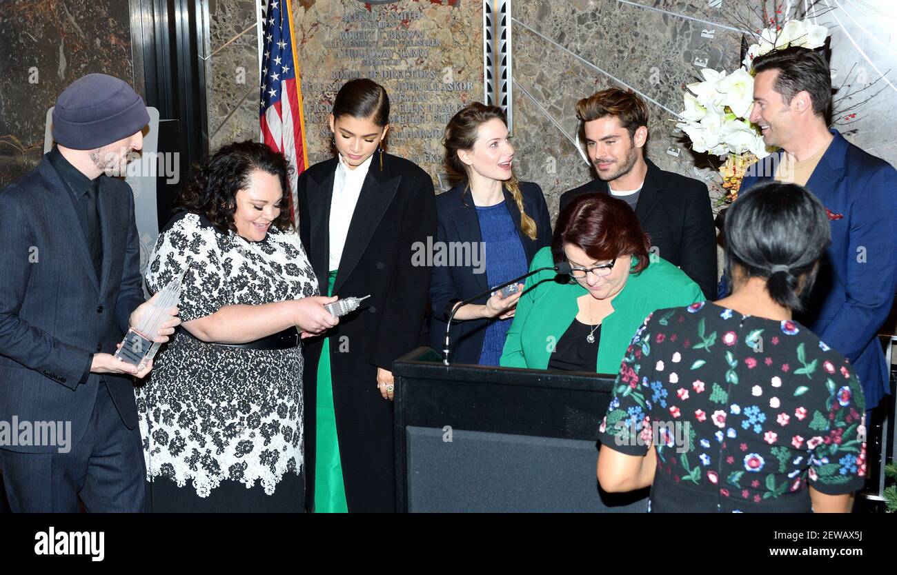 L-R: Director Michael Gracey and actors Kela Settle, Zendaya, Rebecca  Ferguson, Zac Efron and Hugh Jackman of "The Greatest Showman" attend the  lighting ceremony at the Empire State Building in New York,