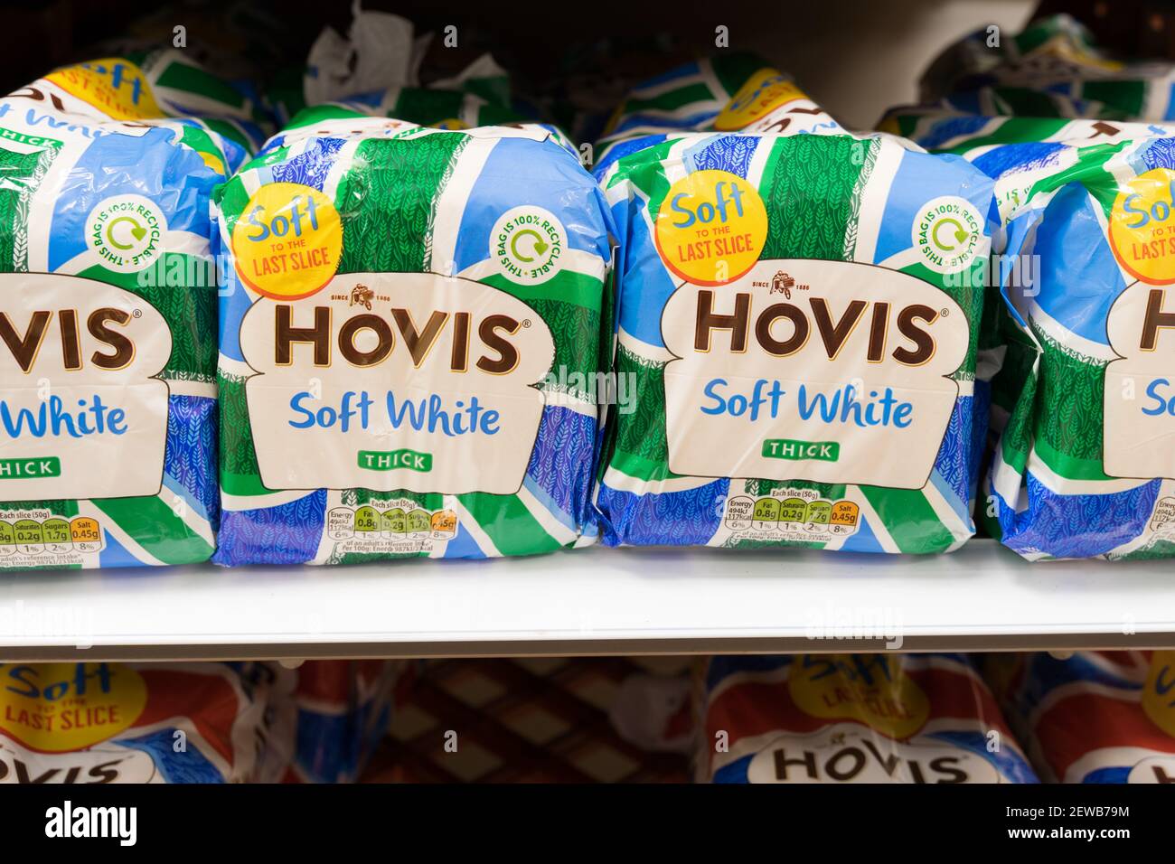 four loaves of sliced bread for toast and sandwiches on shelves for