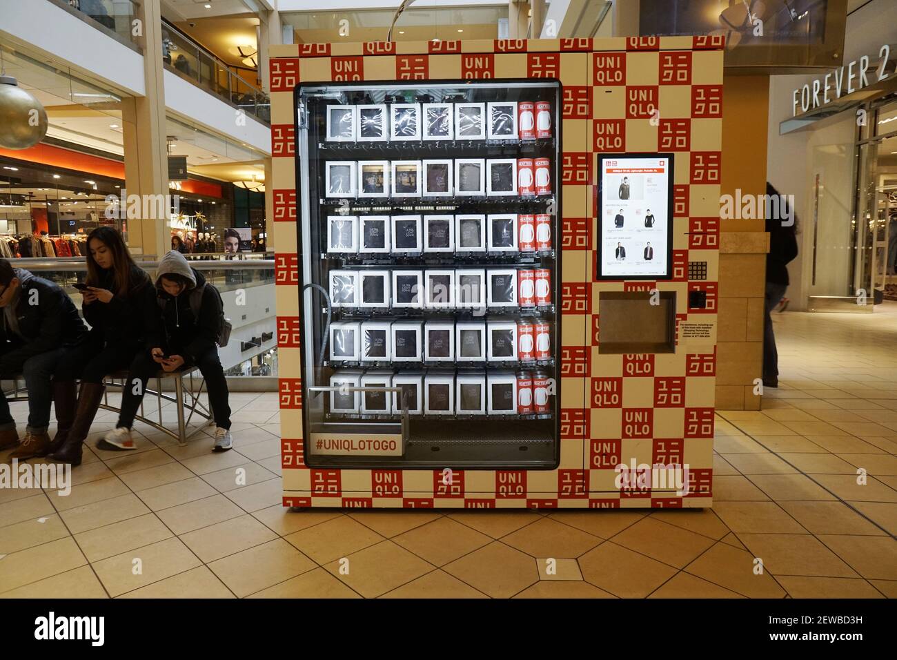 A Uniqlo vending machine dispenses cold weather clothing the Queens Center  Mall in the borough of Queens in New York on Sunday, December 17, 2017, a  week before Christmas. Retailers are reporting