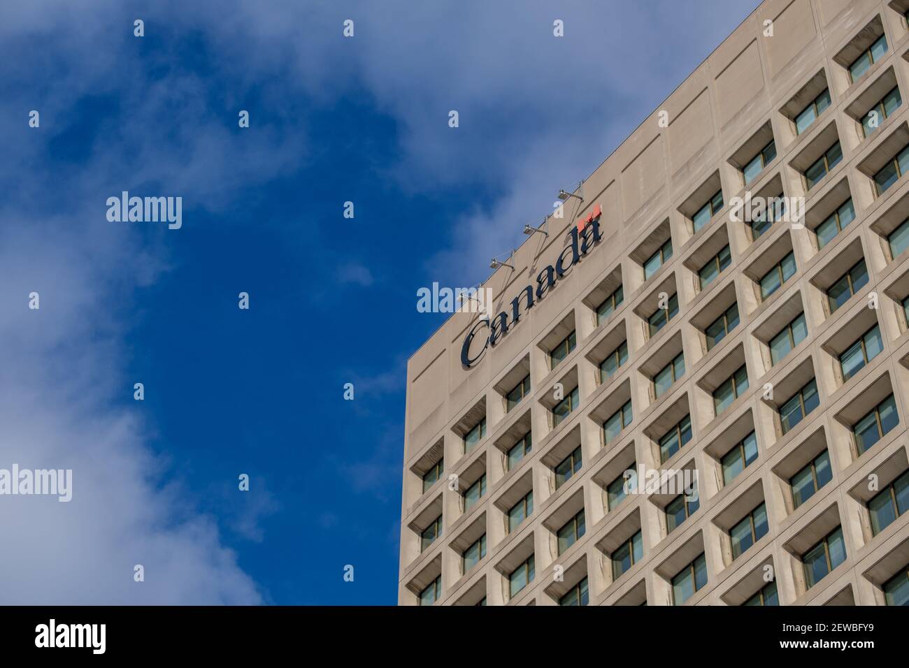 Ottawa, Ontario, Canada - February 6, 2021: An upper part of the northern tower at the Canadian National Defence Headquarters (NDHQ) shows the wordmar Stock Photo