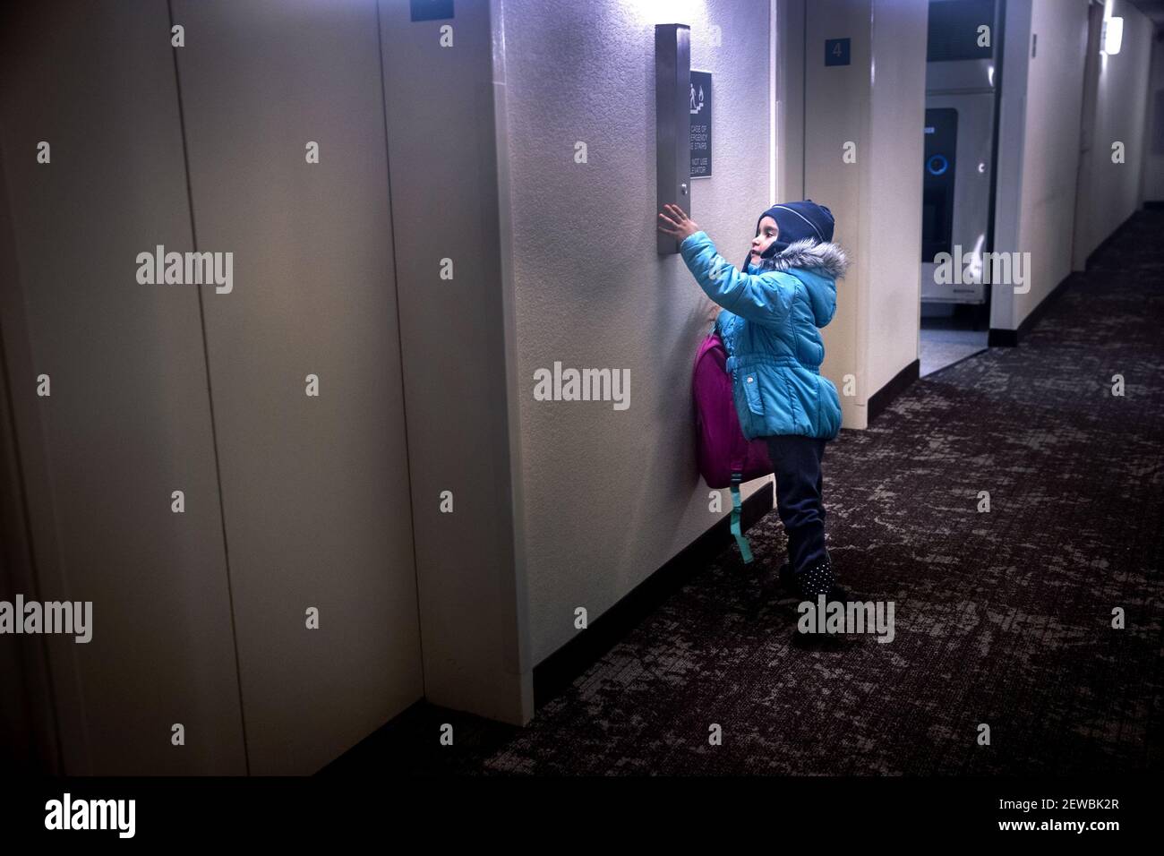 Milianis Rivera, 5, runs out of her room at the Red Roof Inn in Hartford, Conn., to push the button for the elevator on December 21, 2017. Before going to school Rivera and her family will eat the continental breakfast provided by the hotel in the lobby, where they will meet the other families from Puerto Rico temporarily staying at the hotel. (Photo by Lauren Schneiderman/Hartford Courant/TNS/Sipa USA) Stock Photo