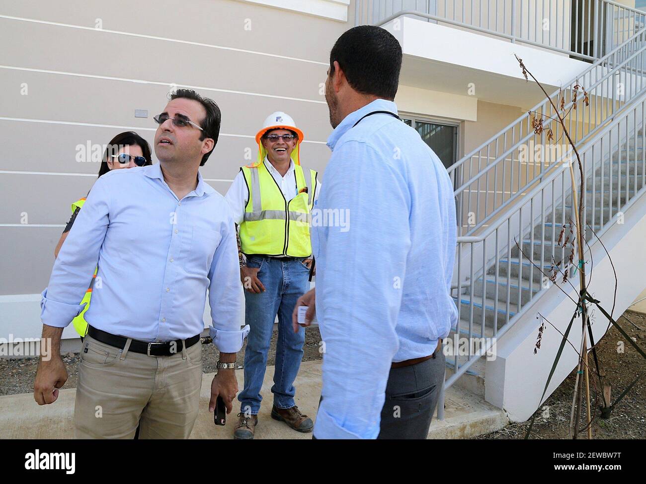 Fernando Gil, right, Puerto Rico's Housing Department Secretary, shares