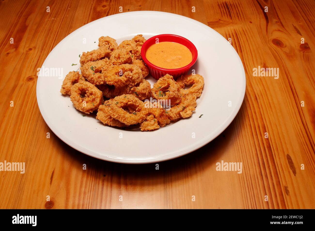 seafood delicacy known as fried calamari rings Stock Photo - Alamy
