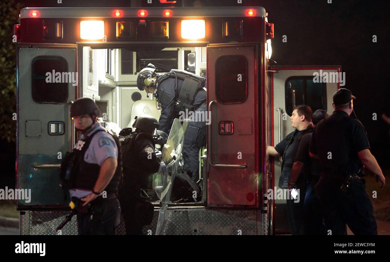 Injured police officers are attended to while they worked near Waterman