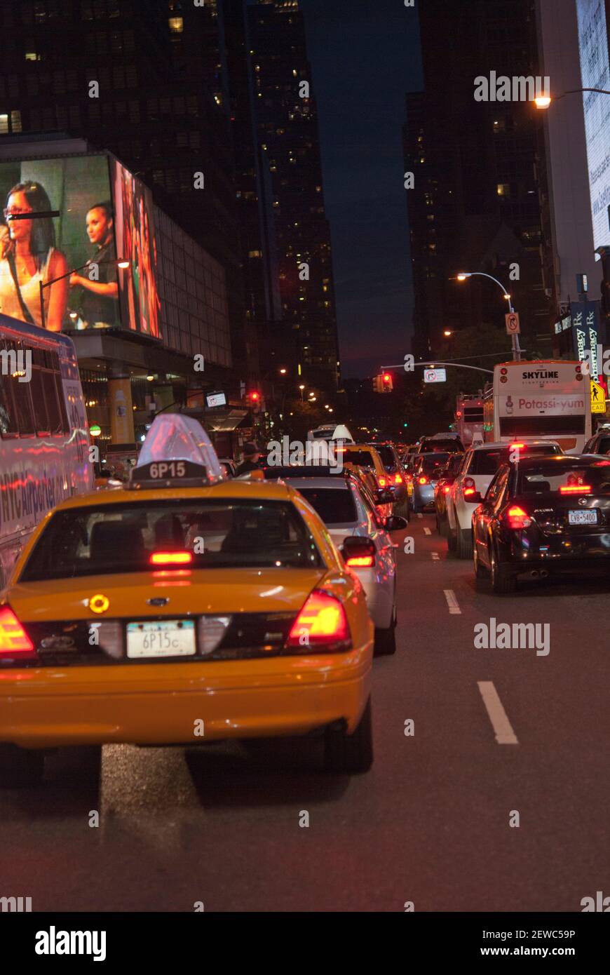 New York yellow taxi on a street at night Stock Photo - Alamy