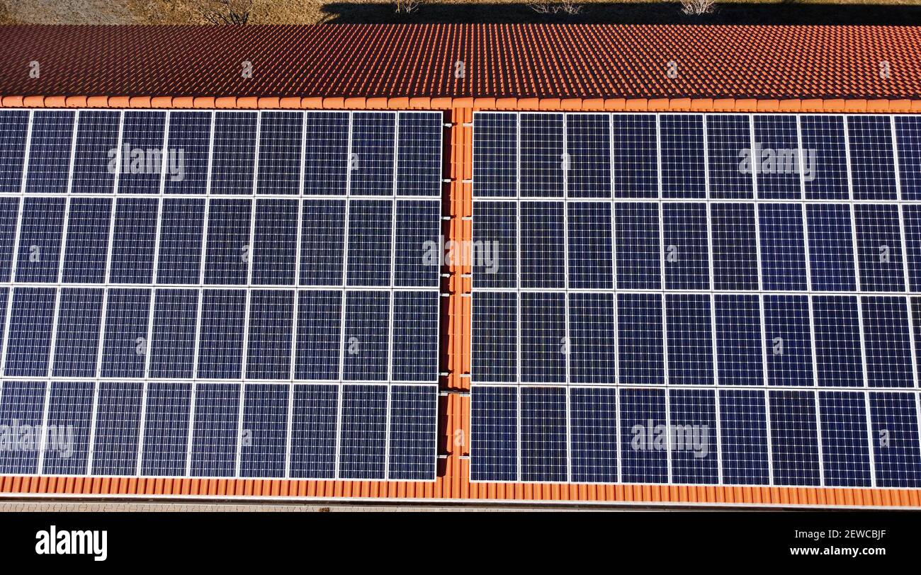 Aerial photograph with a drone of a photovoltaic system on the roof of a house Stock Photo
