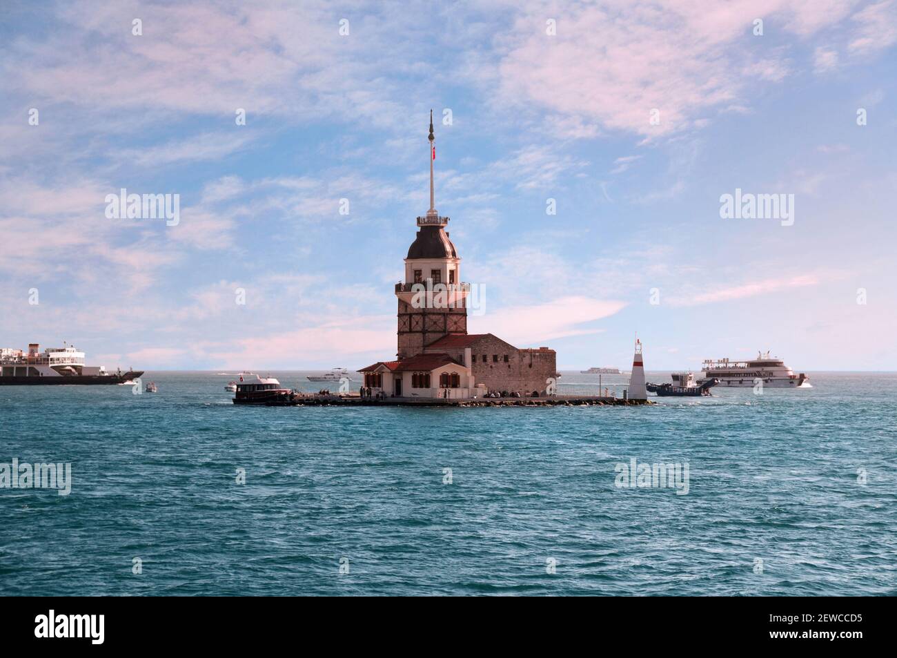 Sunset view from the waters of Bosporus Strait in the centre of Istanbul on Kiz Kulesi - legendary Maiden's Tower also named as Leander's Tower in Stock Photo