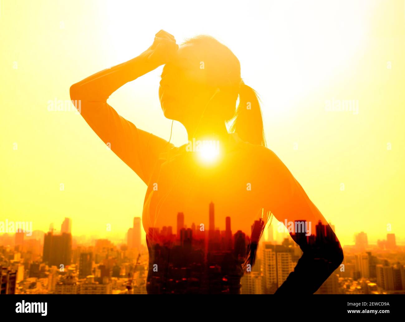 Double exposure portrait of  young Woman hand wiping sweat with summer heat wave background Stock Photo