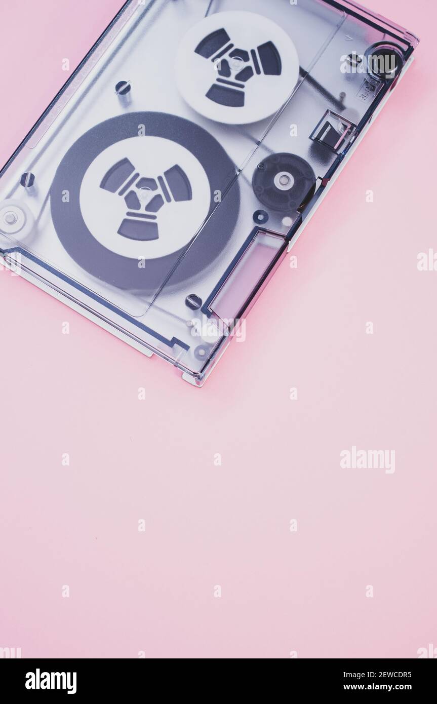 A magnetic tape for data storage in the pink background with a copy space Stock Photo