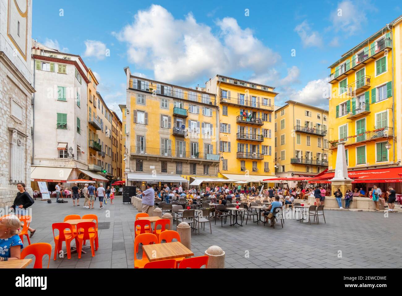 Tourists enjoy a late afternoon at the shops and cafes at Place Rossetti in Old Town Nice, on the French Riviera Stock Photo