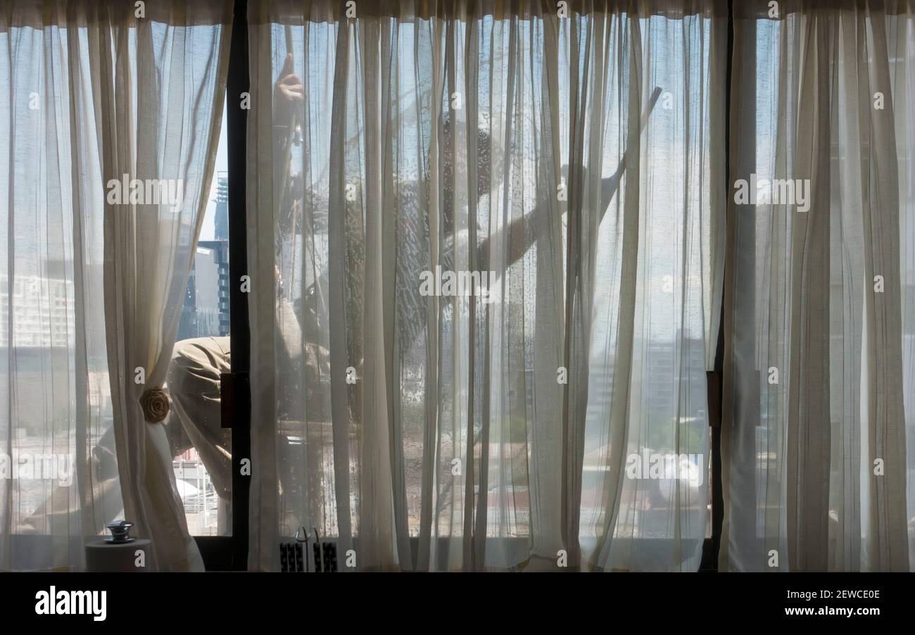 Window cleaner seen from inside Stock Photo
