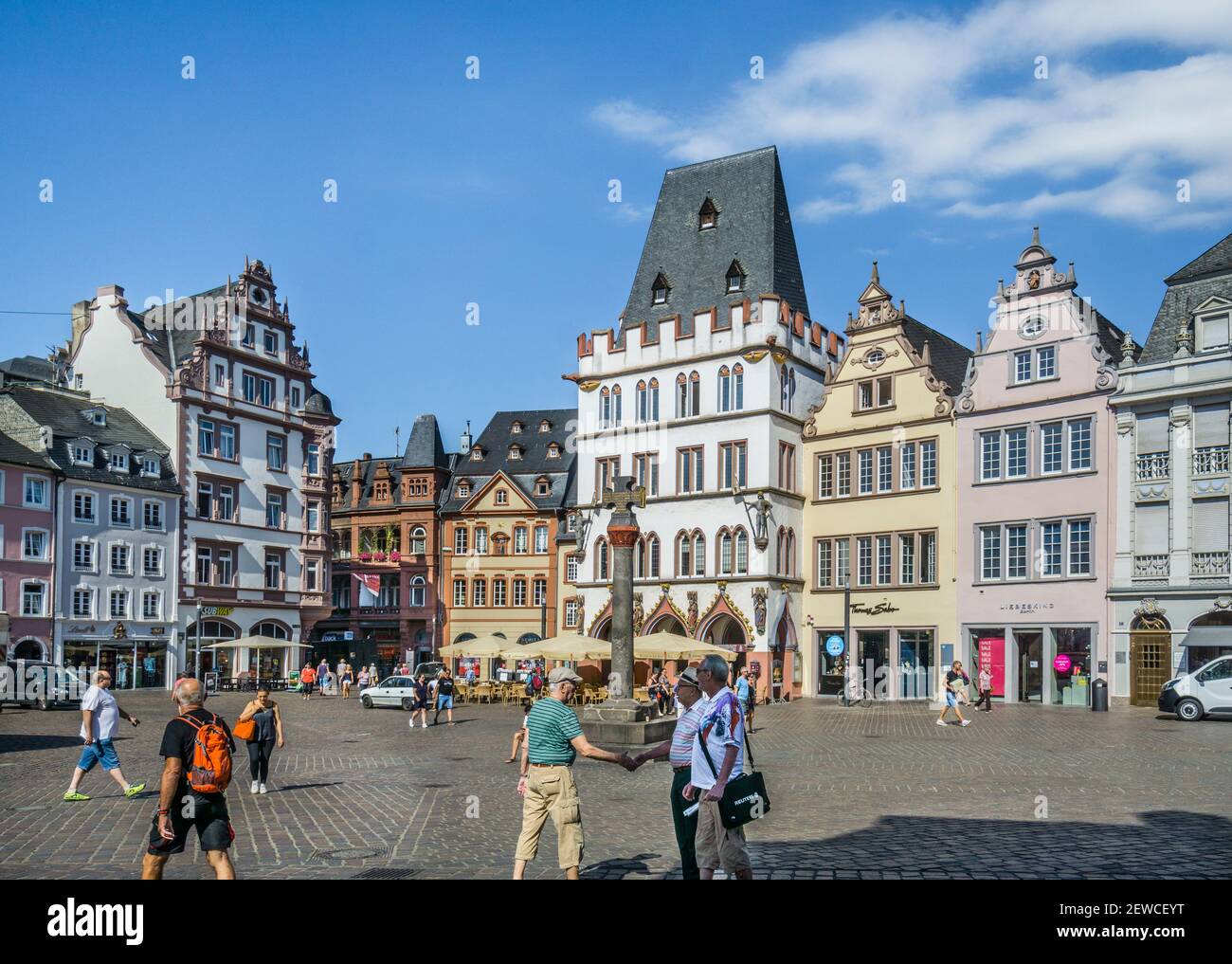 Hauptmarkt the Main Market Square of the ancient city of Trier, with market cross against the backdrop of house facades from the Renaissance, Baroque, Stock Photo