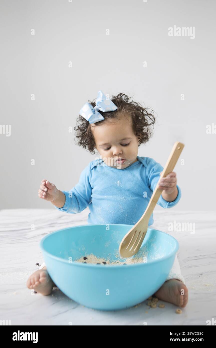 small wooden bowl with wooden baby spoon