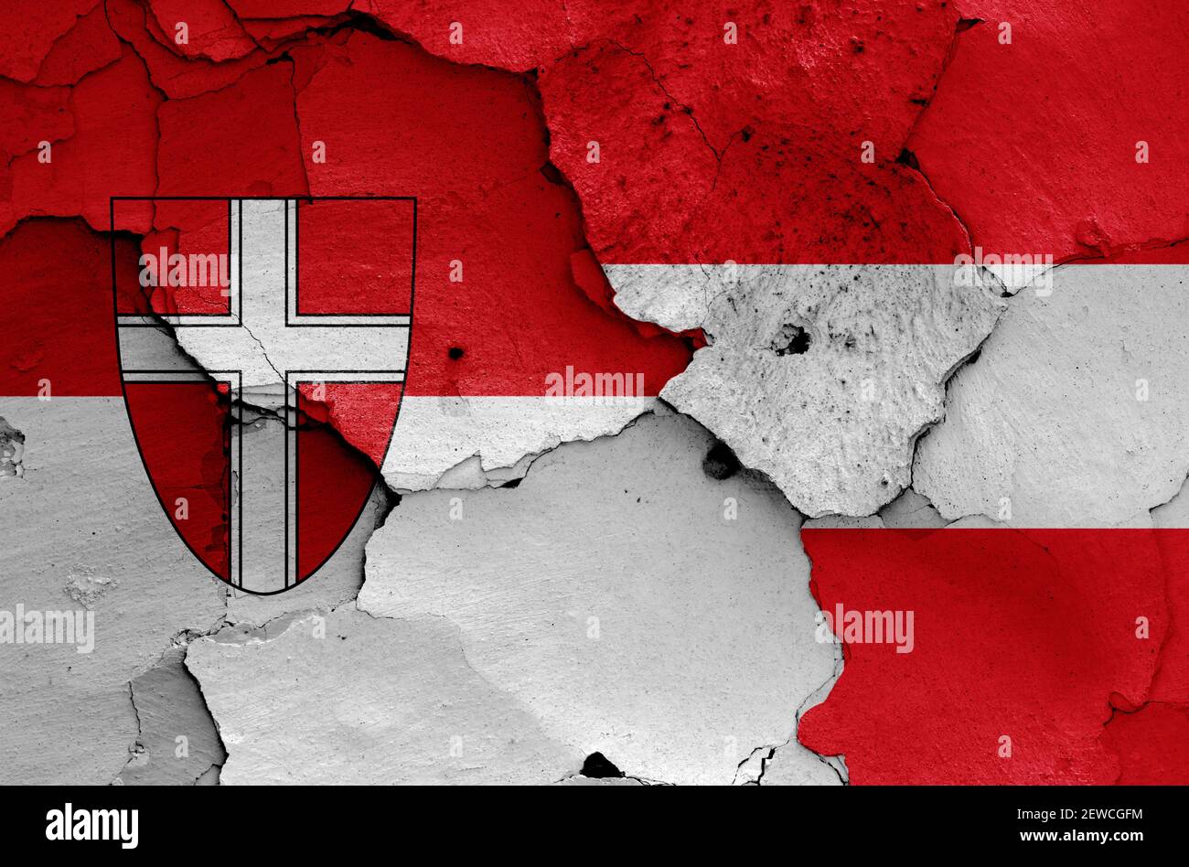 flags of Vienna state and Austria painted on cracked wall Stock Photo