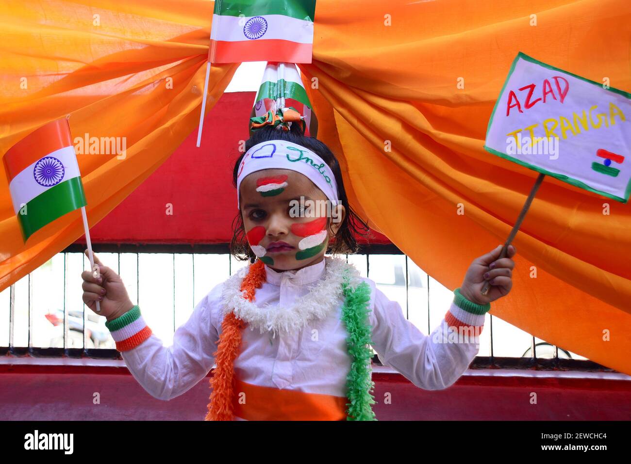 Indian children paint the tricolor of Indian flag on their face and ...