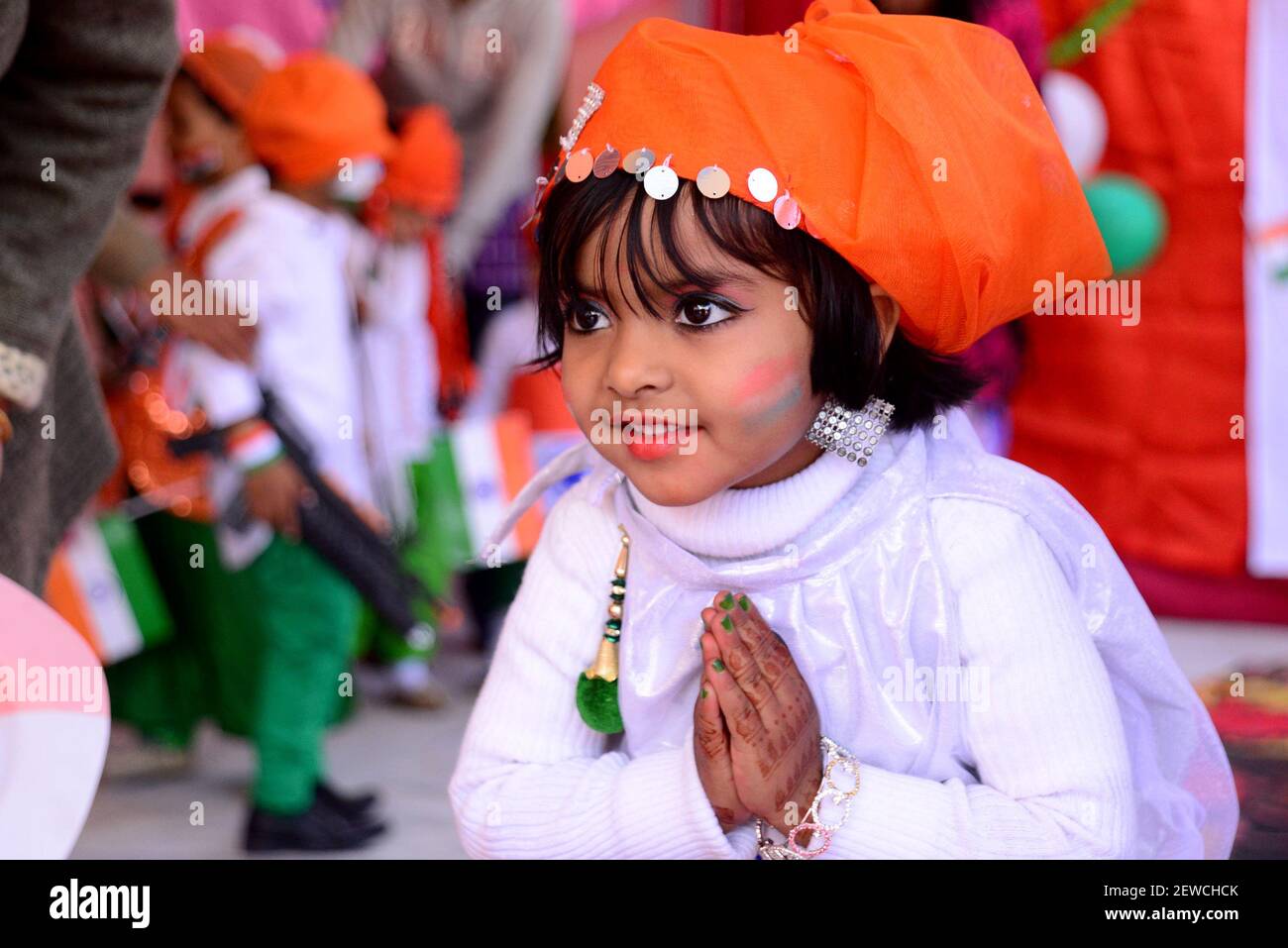 Indian children paint the tricolor of Indian flag on their face and ...