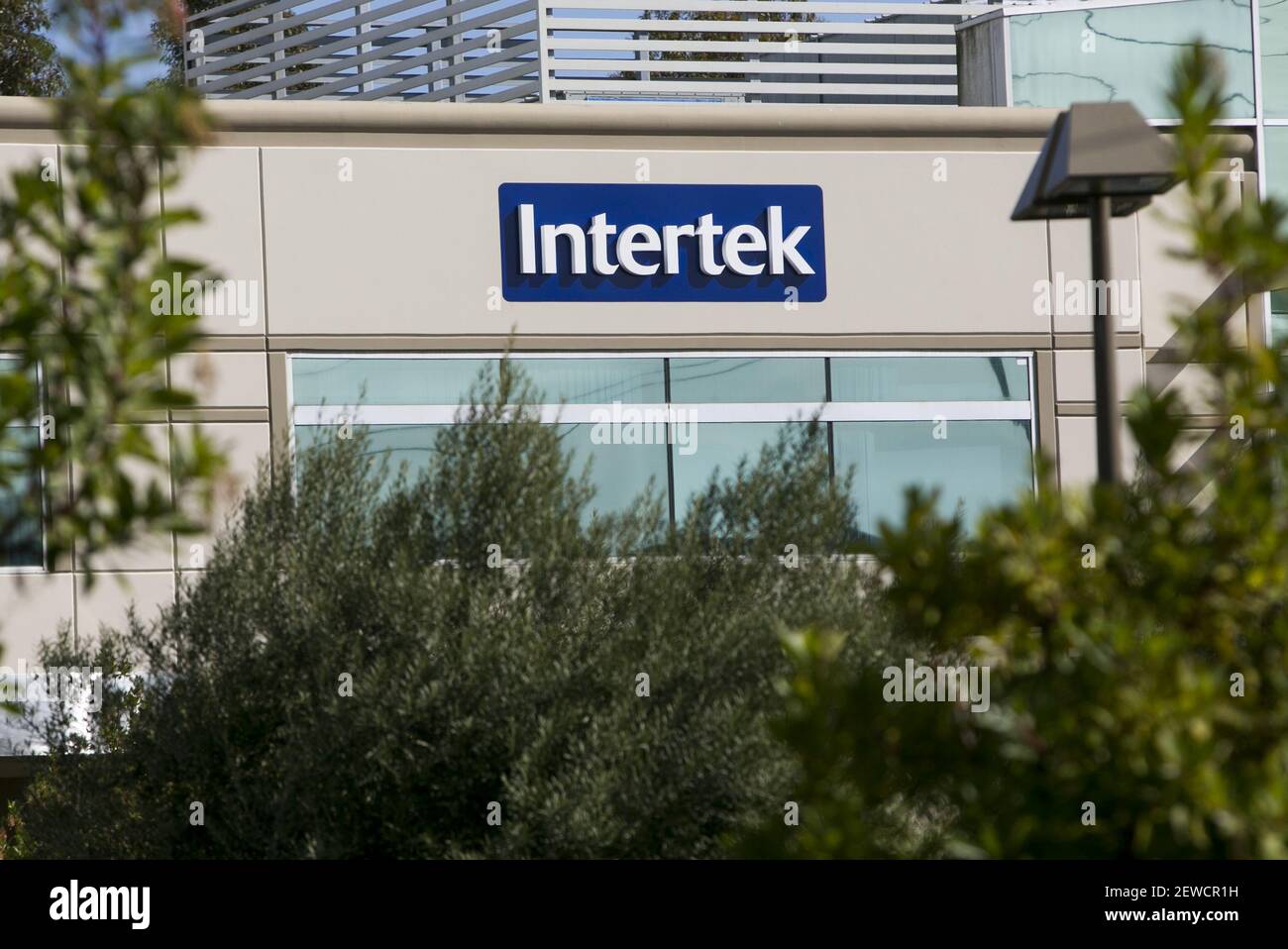 A logo sign outside of a facility occupied by the Intertek Group in San ...