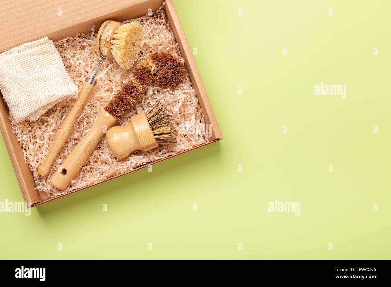 Box with eco friendly cleaning tools. Wooden bamboo brushes, reusable