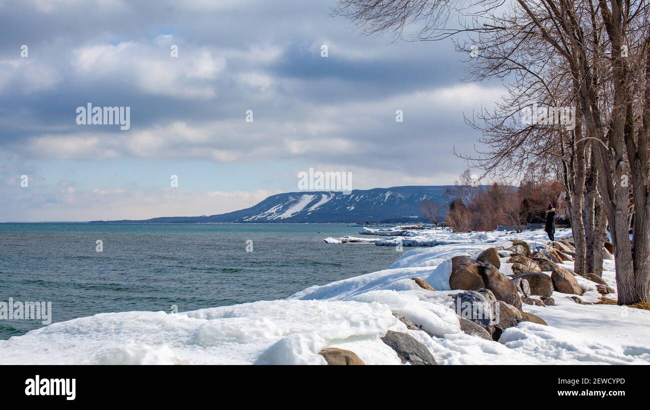 A view of Alpine Ski club and resort ski hills from the Thornbury Marina looking out to Georgian Bay in the winter. Stock Photo