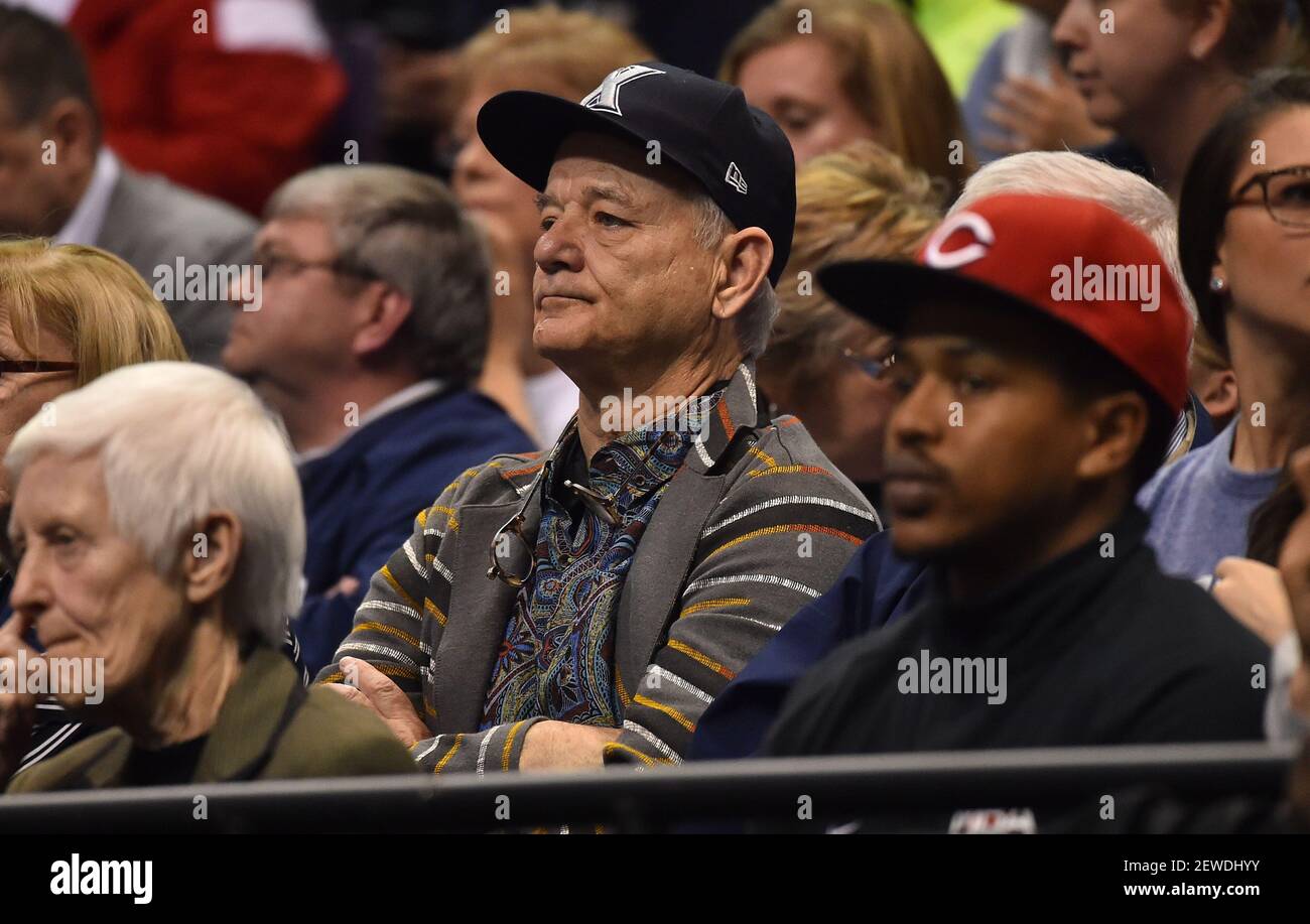 Film actor Bill Murray looks on during the first half of the game between the Wisconsin Badgers and the Xavier Musketeers in the second round of the 2016 NCAA Tournament at Scottrade Center.  Stock Photo