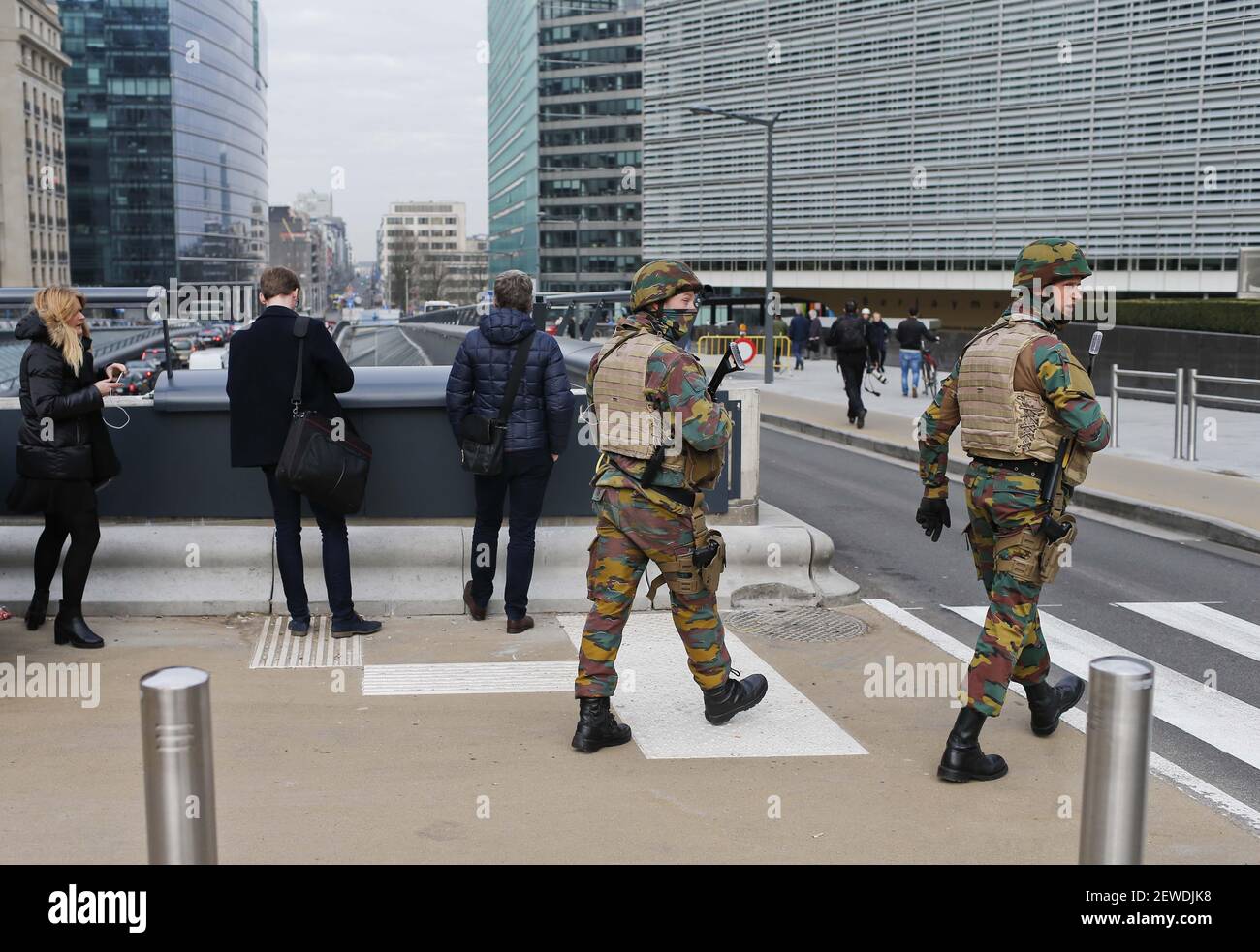 Belgian soldiers partorl outside the EU headquarters in Brussels, Belgium, on March 22, 2016. At least 13 people were reportedly dead after explosions at Brussels airport and a metro station on Tuesday.  Stock Photo
