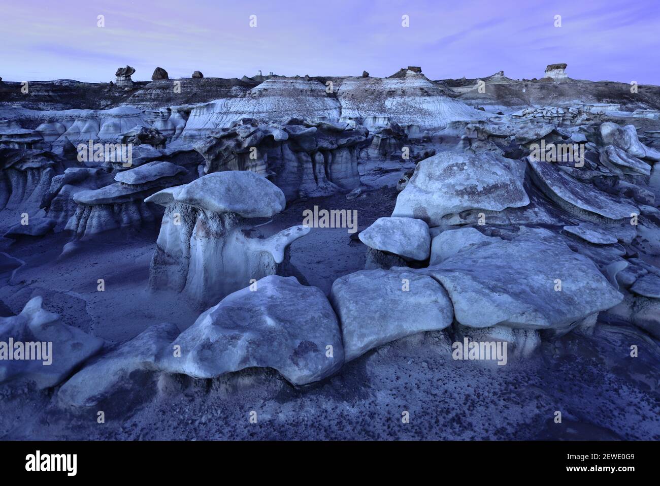 Formations pictured at sunset in the Bisti/De-Na-Zin Wilderness in New Mexico on April 9, 2016. The area was once a delta that lay to the west of the Western Interior Seaway 70 million years ago, and the badlands  were formed by the erosion of the sandy Ojo Alamo Formation. (Photo by Alex Milan Tracy) *** Please Use Credit from Credit Field *** Stock Photo