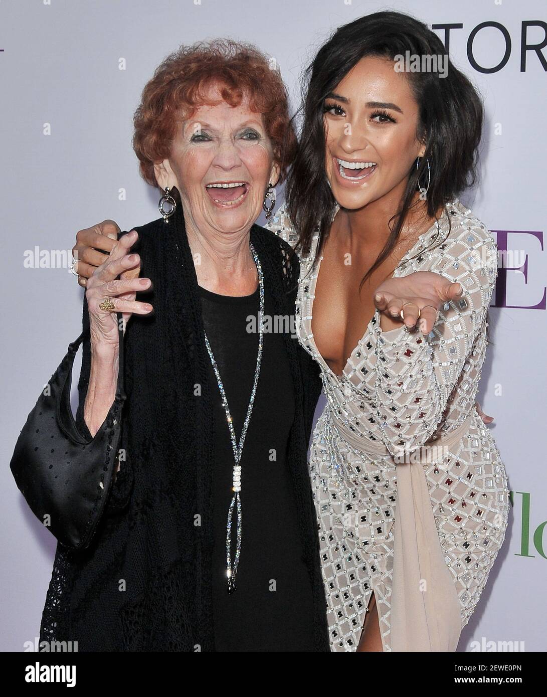 (R-L) Shay Mitchell with her Grandma Red aka Bunny on the redcarpet at the 'Mother's Day' Los Angeles Premiere held at the TCL Chinese Theatre in Hollywood, CA on Wednesday, April 13, 2016 (Photo By Sthanlee B. Mirador) *** Please Use Credit from Credit Field *** Stock Photo