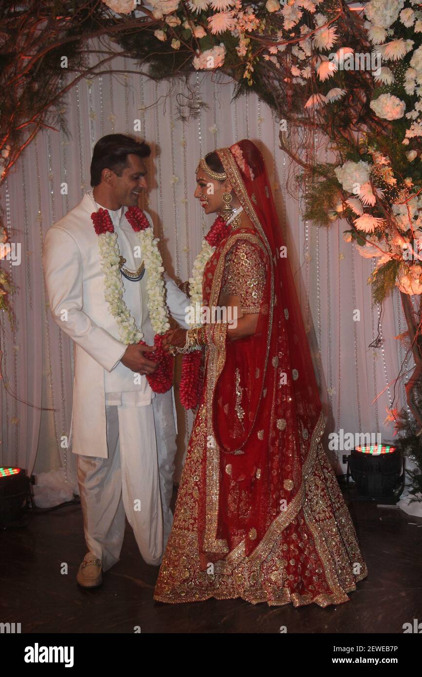 MUMBAI INDIA APRIL 30 Bollywood actor couple Bipasha Basu and Karan Singh pose for shutterbugs after their wedding ceremony on April 30 2016 in Mumbai India. Bipasha Basu got married to