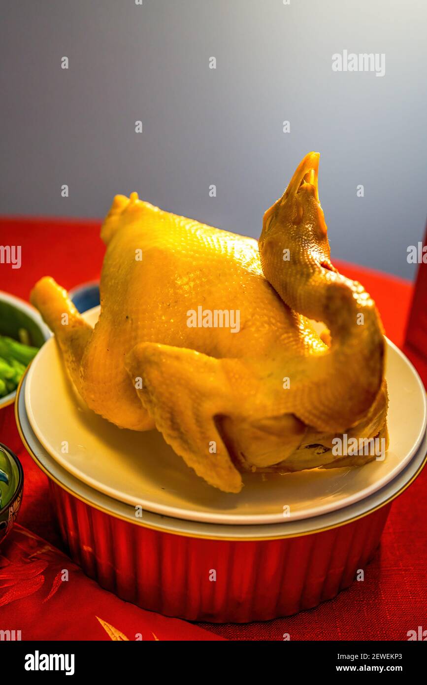 A traditional Chinese New Year Cantonese dish, white sliced chicken, boiled  whole chicken Stock Photo - Alamy