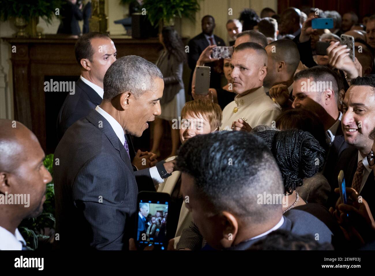 President Barack Obama works the rope line after delivering remarks at ...
