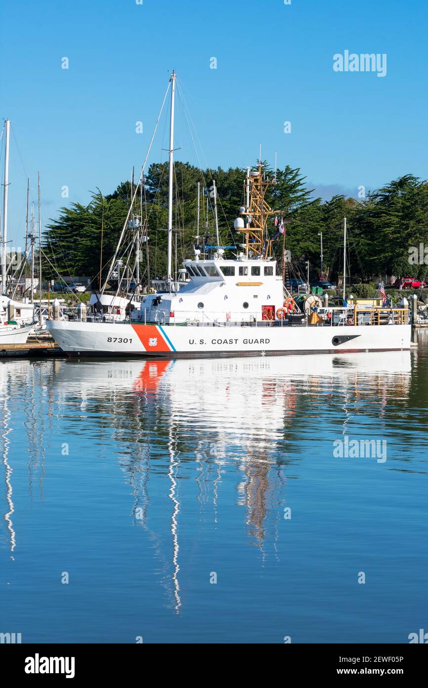 US Coast Guard Cutter Barracuda patrol boat docked on calm water at harbor dock. - Eureka, California, USA - 2021 Stock Photo