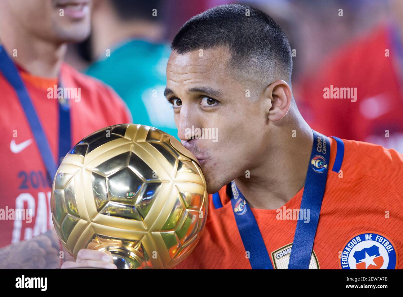 Alexis Sanchez of Chile kisses the Golden Ball Award for Best Player of the  Copa America Centenario after winning the final of 2016 Copa America  Centenario soccer tournament at the Metlife Stadium