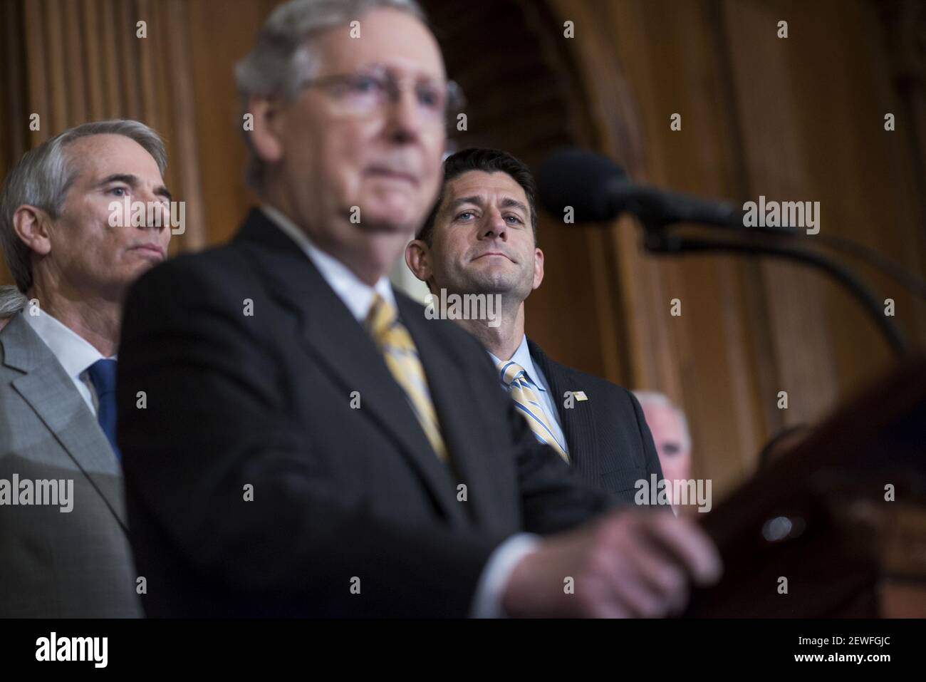 UNITED STATES - JULY 14: From left, Sen. Rob Portman, R-Ohio, Senate Majority Leader Mitch McConnell, R-Ky., and Speaker Paul D. Ryan, R-Wis., attend an enrollment ceremony in the Capitol's Rayburn Room for the 'Comprehensive Addiction and Recovery Act,' July 14, 2016. (Photo By Tom Williams/CQ Roll Call) *** Please Use Credit from Credit Field *** Stock Photo