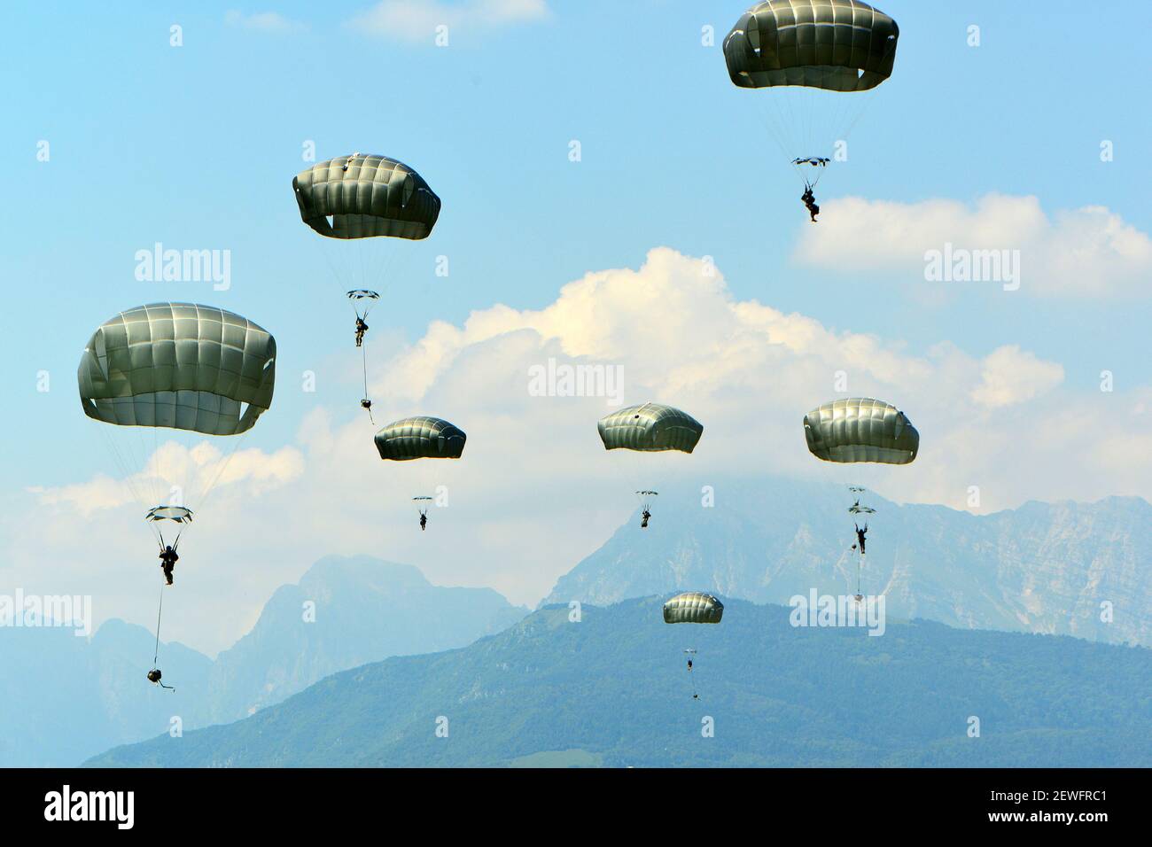 U.S. Army paratroopers assigned to the 54th Engineer Battalion, 173rd Airborne Brigade, conduct an airborne operation from a U.S. Air Force C-130 Hercules aircraft at Frida Drop Zone in Pordenone, Italy, June 29, 2016. The 173rd Airborne Brigade is the U.S. Army Contingency Response Force in Europe, capable of projecting forces anywhere in the U.S,. Europe, Africa or U.S. Central Command's areas of responsibility within 18 hours. (U.S. Army photo by Visual Information Specialist Paolo Bovo)  Please note: Fees charged by the agency are for the agency’s services only, and do not, nor are they in Stock Photo