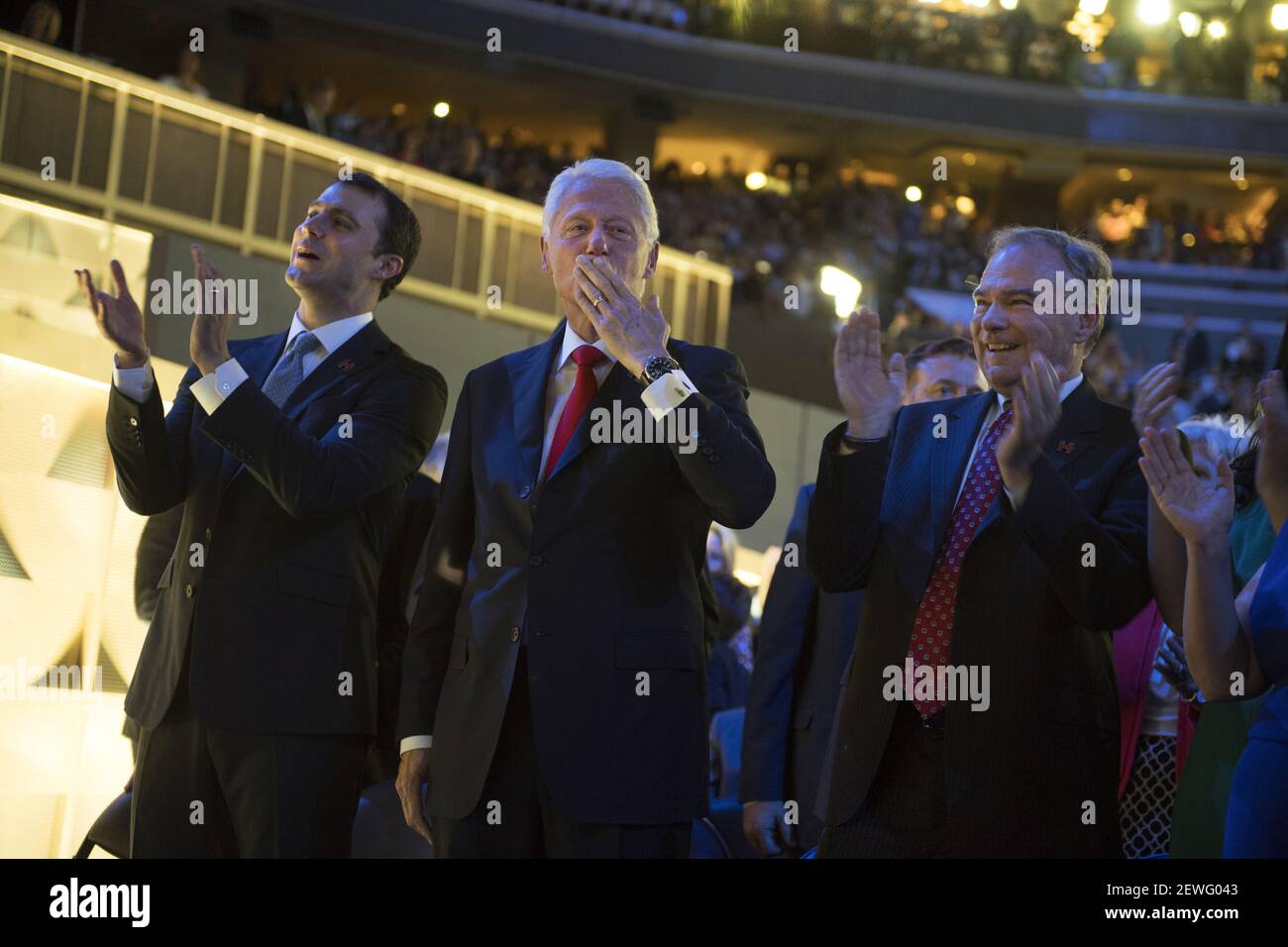 From left, Marc Mezvinsky, his father-in-law, Bill Clinton, and Democratic vice presidential nominee Tim Kaine, appear on the floor of the Wells Fargo Center in Philadelphia, Pa., on the final night of the Democratic National Convention, July 28, 2016.  Stock Photo